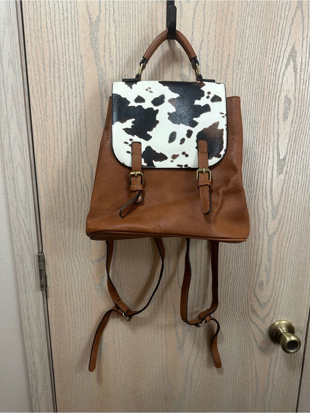 Jen & Co Brooks Convertible Cow Print Faux Leather Backpack - Picture 2 of 12